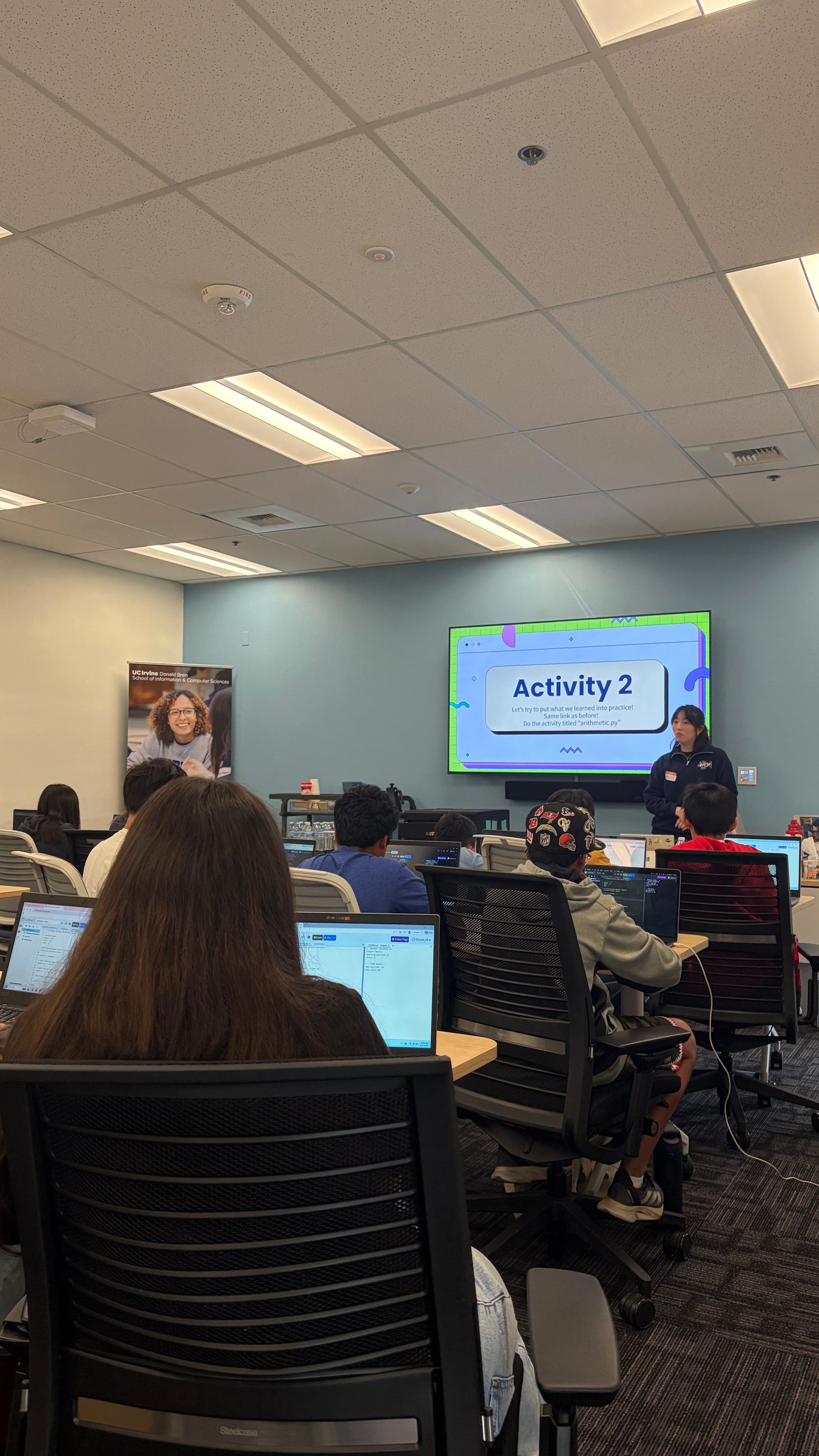 WICS members volunteering and engaging with K–12 students at a community outreach event