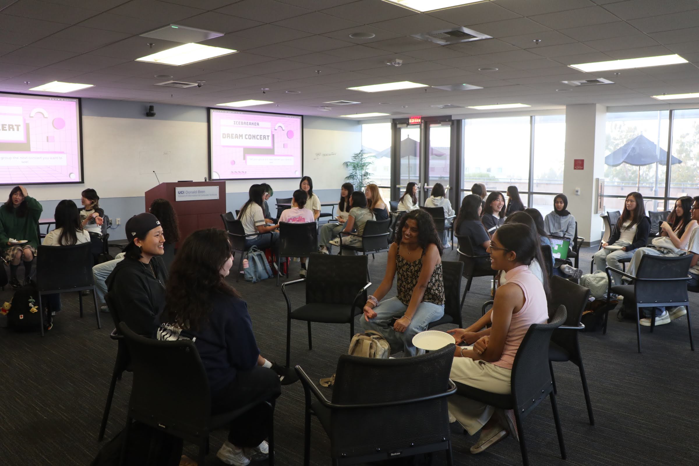 WICS members talking in groups for Intern-taining conversations.